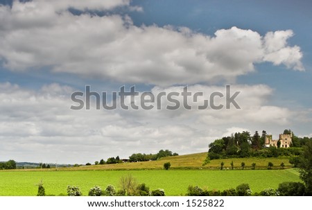French castle and a sky with fluffy clouds