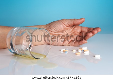 Hand of a person who committed suicide with sleeping tablets and alcohol