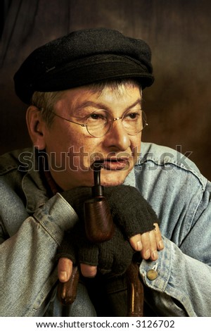 Old village man with pipe and walking stick