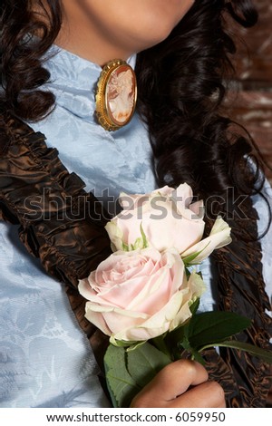 Detail of the antique dress and cameo of a victorian lady