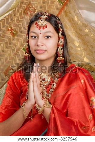 stock photo Young Indian woman wearing saree and bridal jewelry