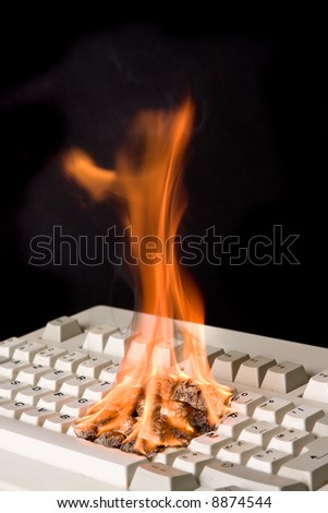 Old computer keyboard on fire due to fast typing?