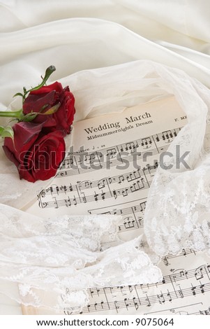 stock photo Sheet music of the Wedding March with roses and bridal veil