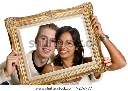 Happy couple of different ethnic origin, showing their love in a frame