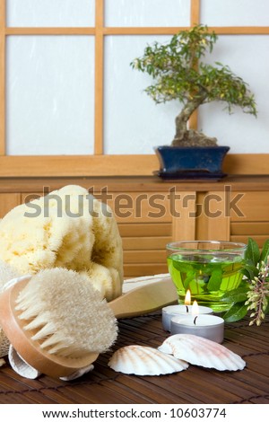 Spa bath products and green tea against a traditional japanese shoji sliding window