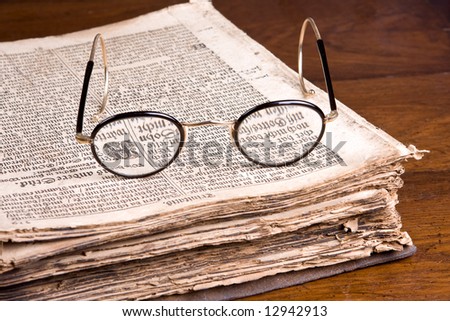 Glasses lying on an old-Germanic religious book of over 300 years old (1691 to be precise)