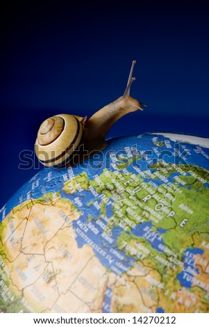 Garden snail travelling around the world on a globe