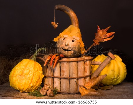 Autumn figurine with pepper hands and gourd face