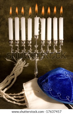 Hanukkah candle-holder, prayer shawl and cap