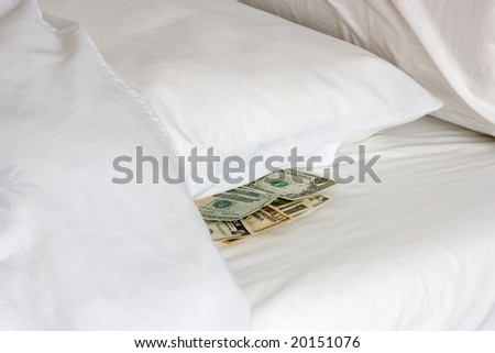 Money tucked away under a pillow during financial crisis