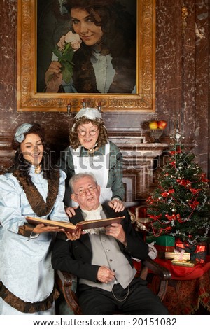 Vintage christmas scene of a victorian family singing christmas carols. Shot in the antique castle \