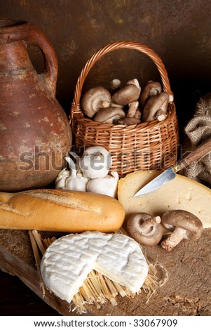 Vintage still life of country food and an antique wine jar