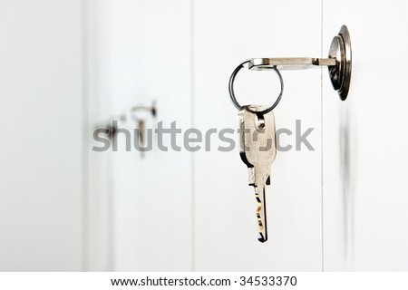 Keys on a row of office cabinets with company files