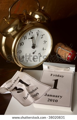 Alarm clock and calendar showing the beginning of New Year