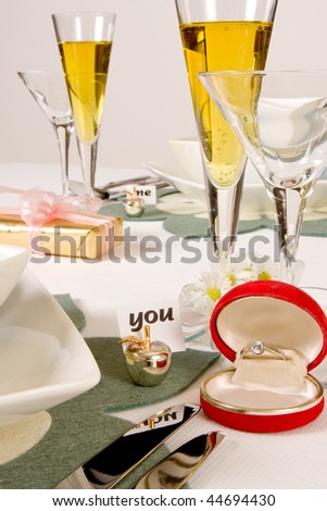 Valentine dinner setting with champagne and ring
