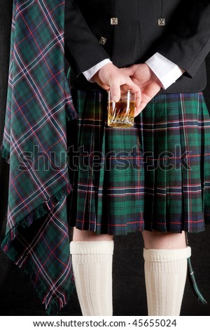 scotsman in kilt. stock photo : Scotsman holding