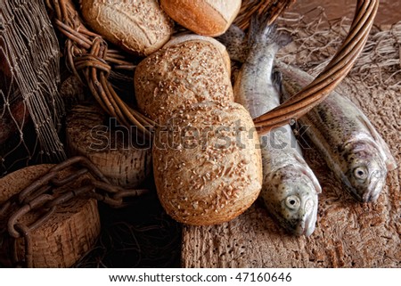 Vintage still life of fresh fish and loaves of bread