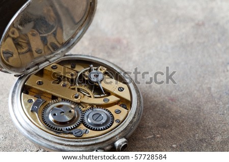 Antique pocket watches with visible jewels inside