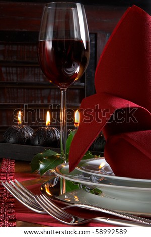 Christmas dinner table detail with red and black accents