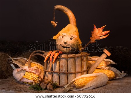 Autumn figurine with gourd head and pepper fingers