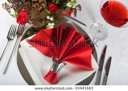 stock photo Festive Christmas or wedding table with red napkins on a white