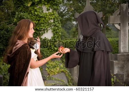 Halloween scene of an evil monk offering an apple