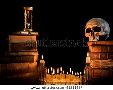Halloween border with skull, ancient books and candles