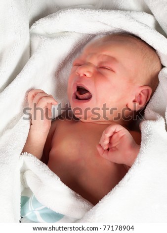 Sixteen days old crying baby turning red