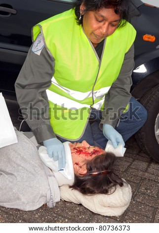 Female car crash victim with whiplash neck brace (the sleeve badges were replaced by a non existing logo)