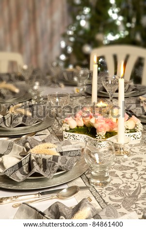 stock photo Christmas dinner table with decorated napkins and flower 