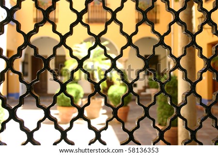 View through grating from wrought iron onto the patio