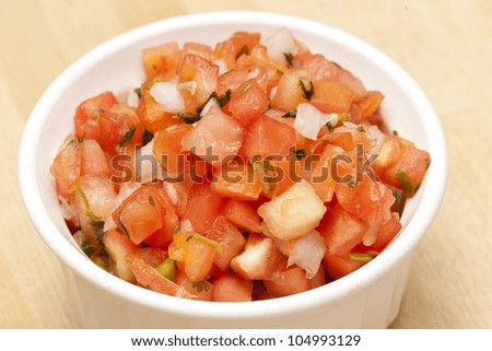 Fresh Red Salsa on a wooden background