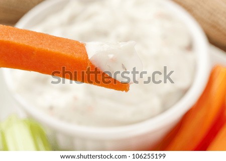 Organic Carrots and Ranch dip on a table