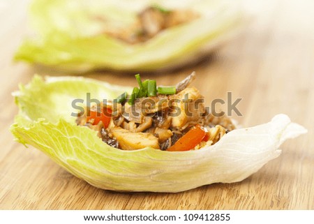Homemade Asian Chicken Lettuce Wraps on a background