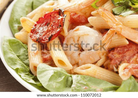 Homemade Shrimp Pasta with tomatoes and green spinach