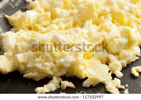 Fresh Organic Scrambled Eggs in a frying pan