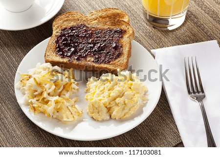 Homemade Wholesome American Breakfast with eggs, toast, and hashbrowns