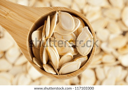 Baked and Salted Pumpkin Seeds on a background