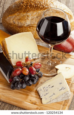 Red Wine And Assorted Cheese Plate with fruit
