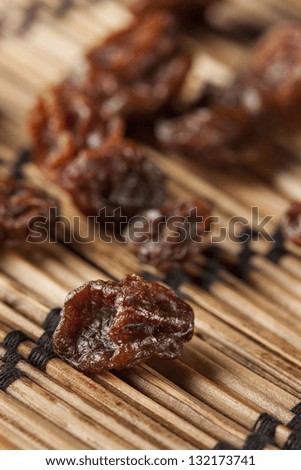 Organic Dried Raw Raisins against a background