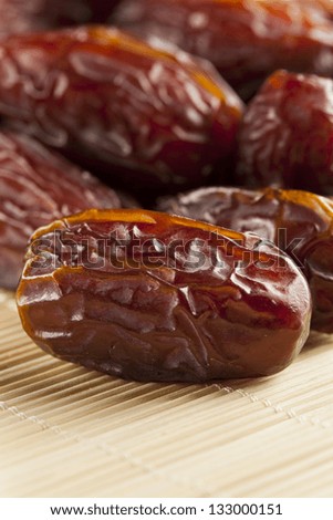 Fresh Organic Raw Brown Date Fruit against a background