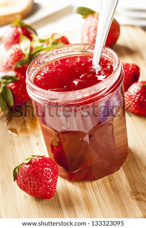 Homemade Organic Red Strawberry Jelly against a background