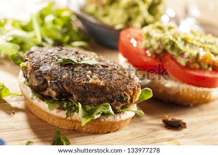 Homemade Organic Vegetarian Mushroom Burger with tomato and guacamole