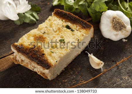 Homemade Crunchy Garlic Bread with butter and parsley