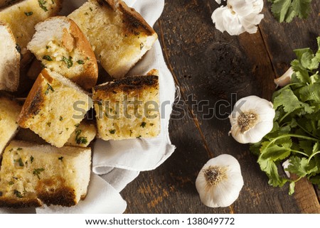 Homemade Crunchy Garlic Bread with butter and parsley