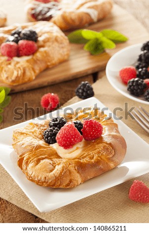 Homemade Gourmet Danish Pastry with berries and icing