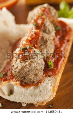 Homemade Spicy Meatball Sub Sandwich with Marinara Sauce and Cheese