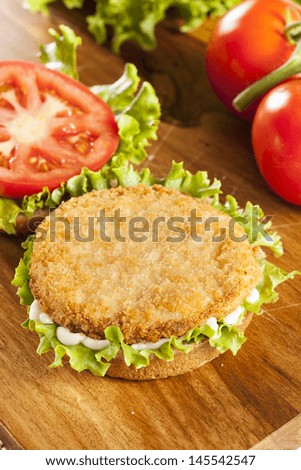 Breaded Chicken Patty Sandwich on a Bun with Lettuce and Tomato