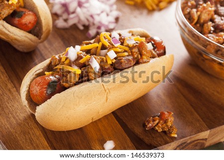 Homemade Hot Chili Dog with Cheddar Cheese and Onions