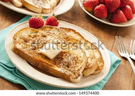Homemade French Toast with Butter and Powdered Sugar